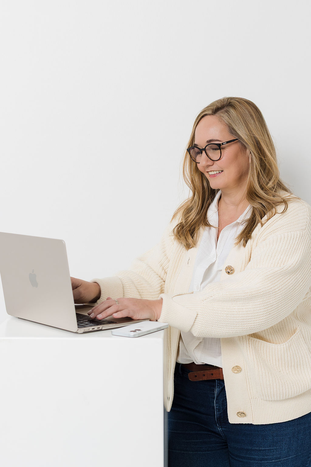 Kobie at her laptop, replying to a message